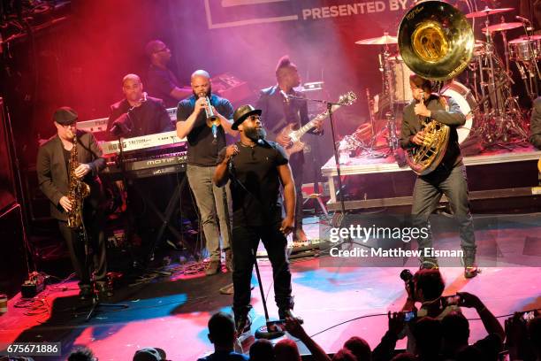 Musicians Black Thought, Captain Kirk Douglas, Tuba Gooding Jr. And Questlove of The Roots perform live on stage during Live Nation's celebration of...