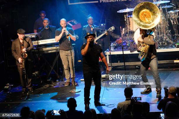 Musicians Black Thought, Captain Kirk Douglas, Tuba Gooding Jr. And Questlove of The Roots perform live on stage during Live Nation's celebration of...