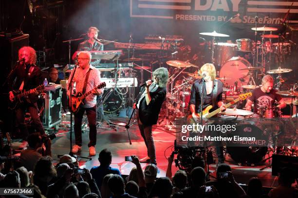 Musicians Bruce Watson, Mick Jones, Mike Bluestein, Kelly Hansen, Jeff Pilson and Chris Frazier of the band Foreigner perform live on stage during...