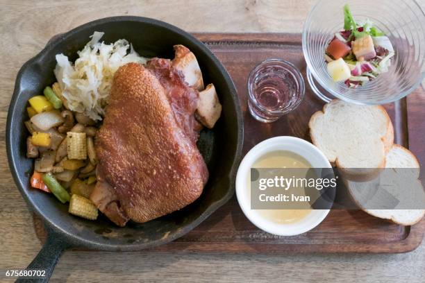 baked glazed christmas holiday food, roasted pork ham meat dinner with salad - pork shoulder stock pictures, royalty-free photos & images