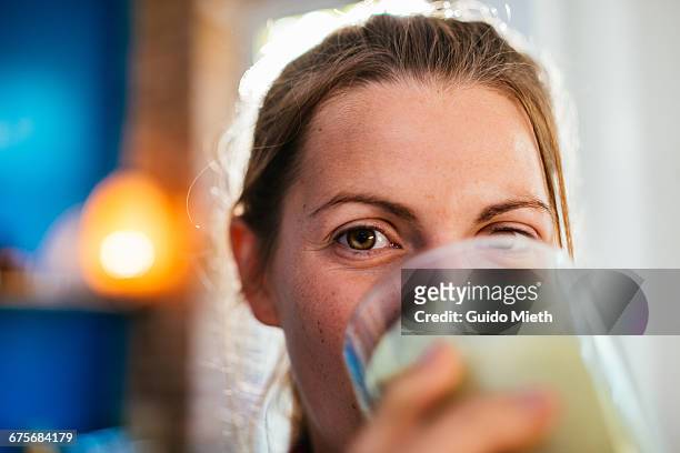 woman enjoying fresh smoothie. - fruit smoothie stock pictures, royalty-free photos & images