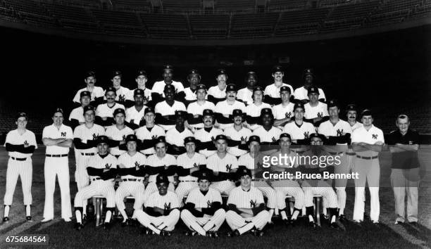 The 1982 New York Yankees pose for the team photo Bucky Dent, Bobby Murcer, coach Yogi Berra, Mike Ferraro, Gene Michael, Jeff Torborg, Joe...
