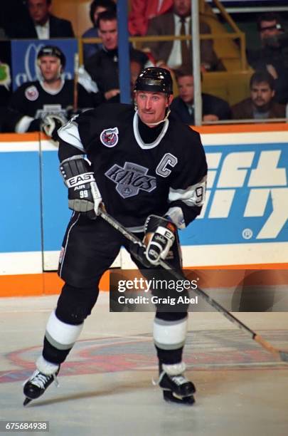 Wayne Gretzky of the Los Angeles Kings watches the play develop against the Toronto Maple Leafs during NHL semi final series playoff game action on...