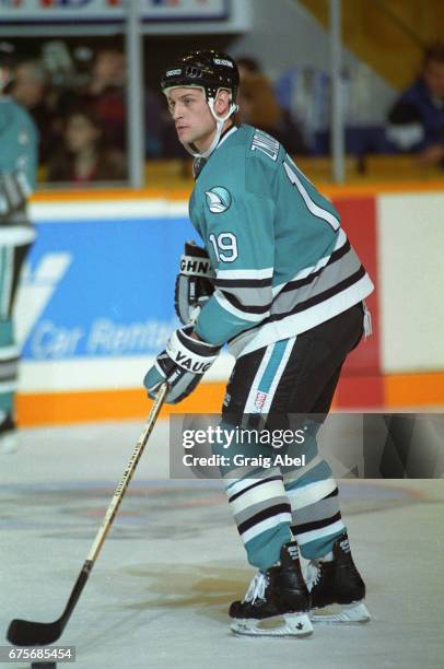 Doug Zmolek of the San Jose Sharks controls the puck against the Toronto Maple Leafs on October 24, 1992 at Maple Leaf Gardens in Toronto, Ontario,...