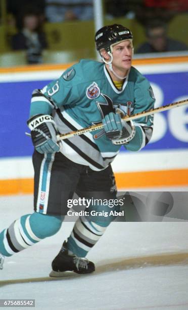 Doug Zmolek of the San Jose Sharks skates up ice against the Toronto Maple Leafs on October 24, 1992 at Maple Leaf Gardens in Toronto, Ontario,...