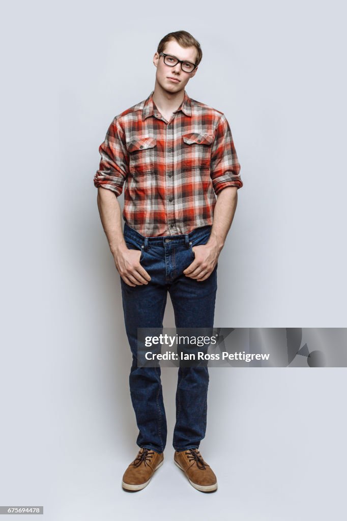 Portrait of man with jeans & red check shirt
