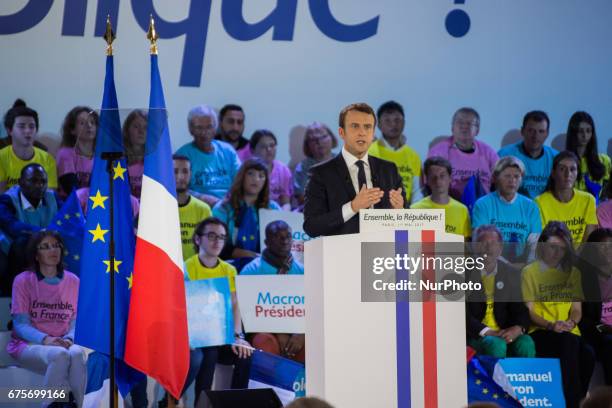 French Presidential Candidate Emmanuel Macron addresses voters during a political meeting at Grande Halle de La Villette on May 1, 2017 in Paris,...