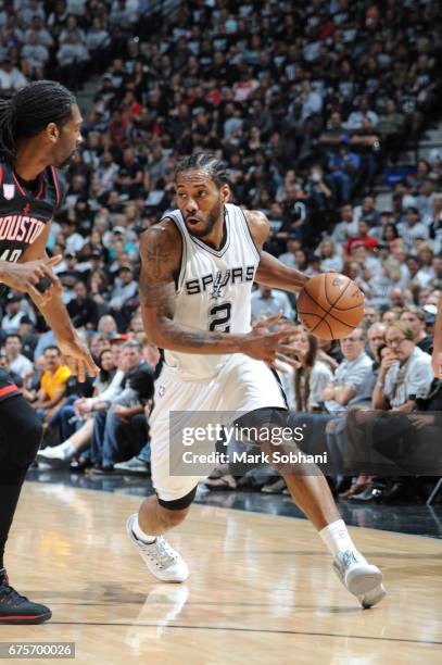 Kawhi Leonard of the San Antonio Spurs handles the ball against the Houston Rockets during Game One of the Western Conference Semifinals of the 2017...