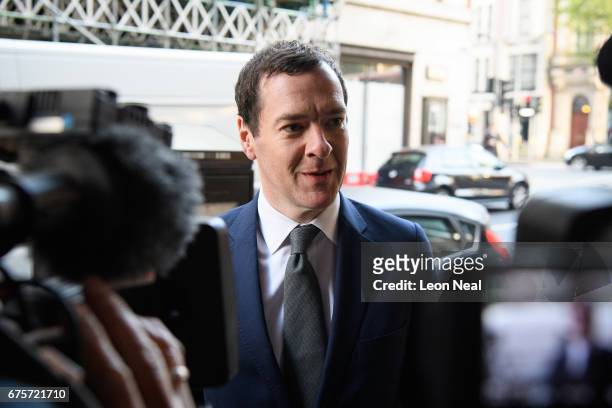 Former Chancellor of the Exchequer George Osborne arrives at the offices of the Evening Standard newspaper on his first official day in the role of...