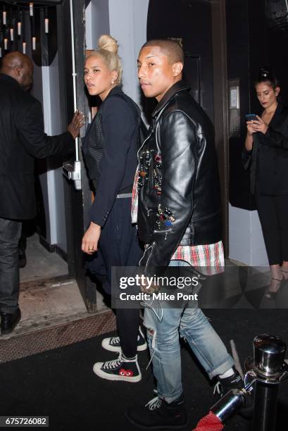 Pharrell Williams and Helen Lasichanh attend the Rei Kawakubo/Comme des Garcons: Art Of The In-Between" Costume Institute Gala after party at 1 Oak...