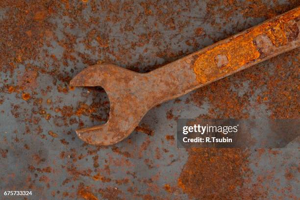 old rusty tool - schraubenschlüssel stock-fotos und bilder