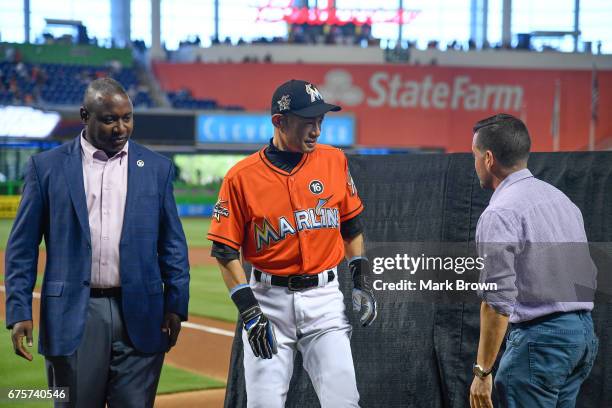 President of the Miami Marlins David P. Samson and President of Baseball Operations Michael Hill honor Ichiro Suzuki of the Miami Marlins for his...