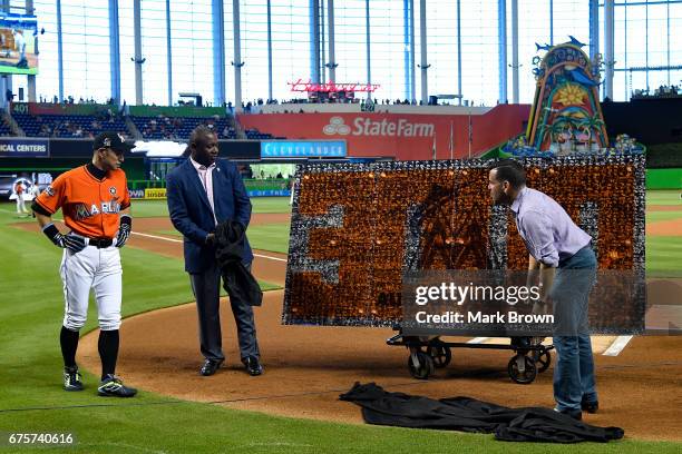 President of the Miami Marlins David P. Samson and President of Baseball Operations Michael Hill honor Ichiro Suzuki of the Miami Marlins for his...