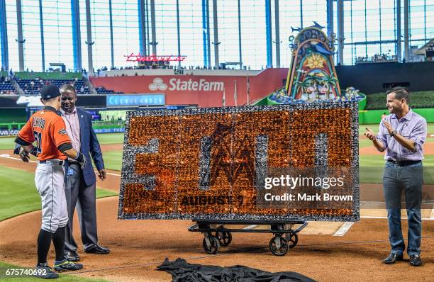 President of the Miami Marlins David P. Samson and President of Baseball Operations Michael Hill honor Ichiro Suzuki of the Miami Marlins for his...