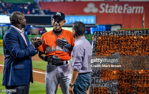 President of the Miami Marlins David P. Samson and President of Baseball Operations Michael Hill honor Ichiro Suzuki of the Miami Marlins for his...