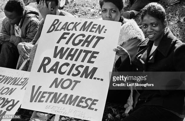 Portrait of anti-Vietnam War protestors with a sign on the National Mall during the March on the Pentagon demonstration, Washington DC, October 21,...