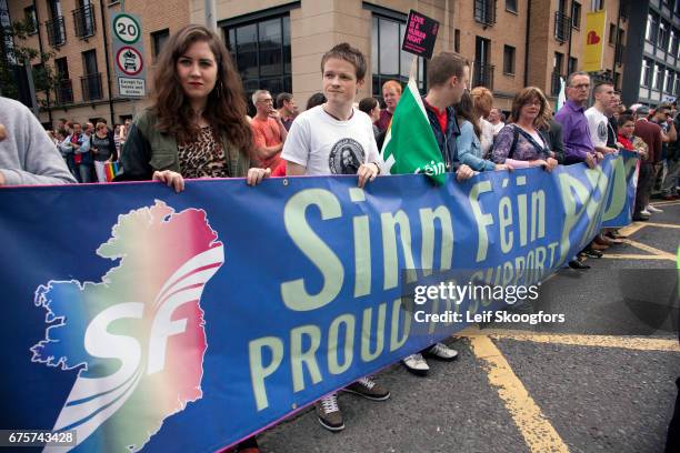 During the annual Gay Pride Parade, participants hold a banner that reads 'Sinn Fein Proud to Support Pride,' Belfast, Northern Ireland, August 4,...