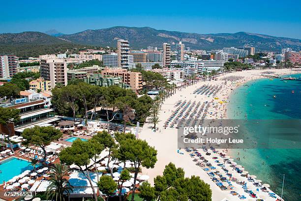 overhead of playa de magaluf beach - spain beach stock pictures, royalty-free photos & images