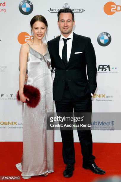 Paula Beer and guest attend the Lola - German Film Award red carpet at Messe Berlin on April 28, 2017 in Berlin, Germany.