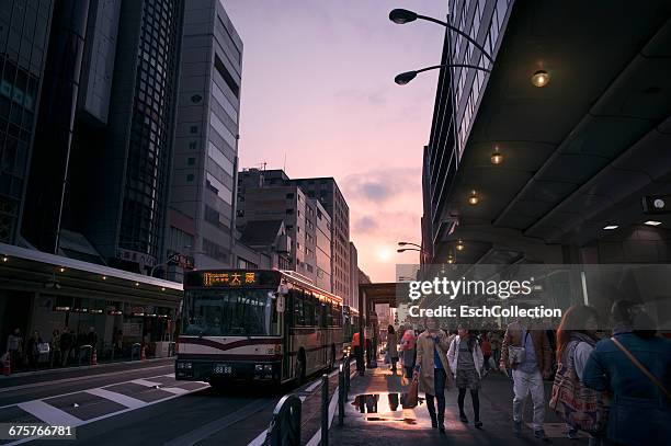 bustling center of kyoto at sunset, japan - bus station stock pictures, royalty-free photos & images