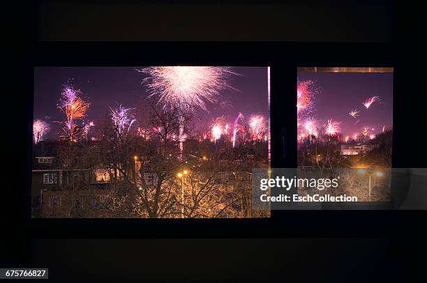 fireworks display at neighborhood, new year's eve - eindhoven netherlands stock pictures, royalty-free photos & images