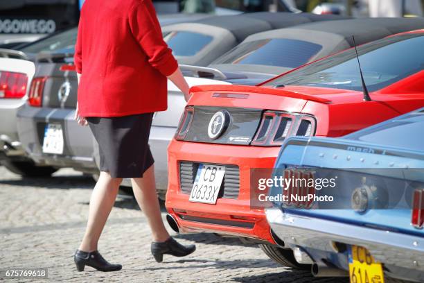 Different models of Ford Mustangs are seen during a classic car show on the Old Market Square in Bydgoszcz, Poland on 1 May, 2017.