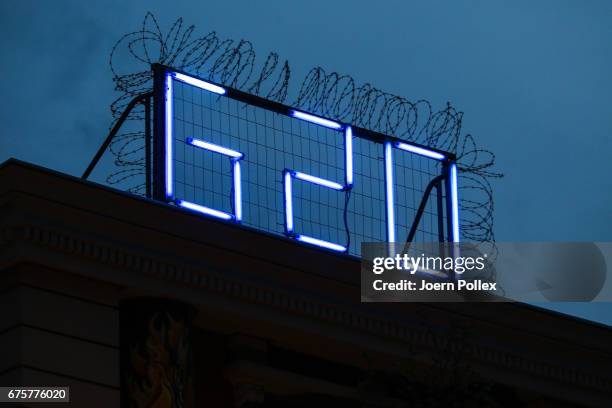 Is seen in fluorescent letters on the top of 'Rote Flora' on May 1, 2017 in Hamburg, Germany. Hamburg will host the G20 summit in July.