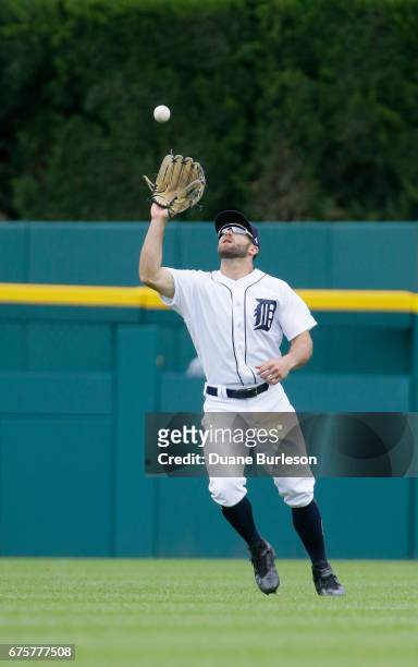 Center fielder Tyler Collins catches a fly ball hit by Taylor Motter of the Seattle Mariners for and out during the fifth inning at Comerica Park on...