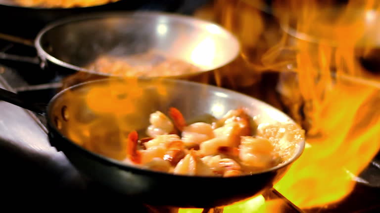 Flames Burn Under A Frying Pan Filled With Shrimp High-Res Stock Video  Footage - Getty Images