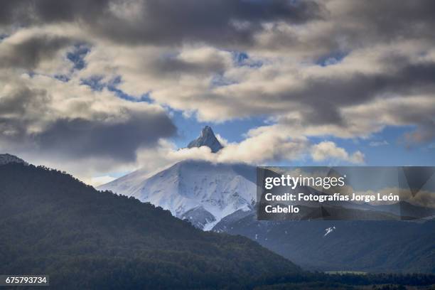 volcan puntiagudo view from the catamaran during the winter andean lake crossing - destinos turísticos bildbanksfoton och bilder