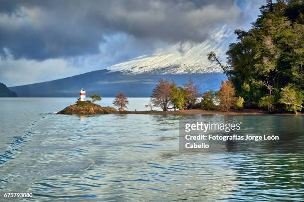 volcan osorno view from the catamaran during the winter andean lake crossing - luz del sol stock pictures, royalty-free photos & images