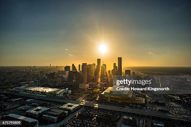 aerial view of houston at sunset - houston stock-fotos und bilder