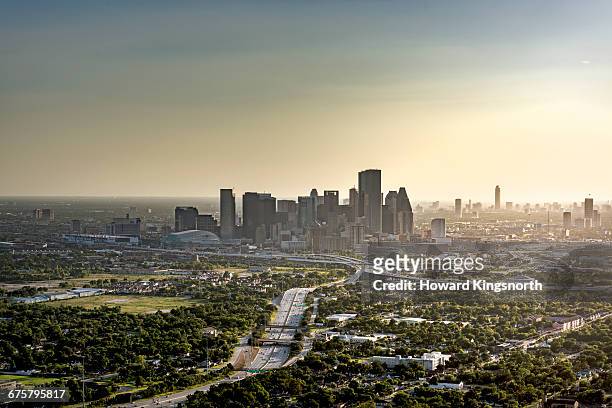 aerial view of houston at sunset - houston texas stock pictures, royalty-free photos & images