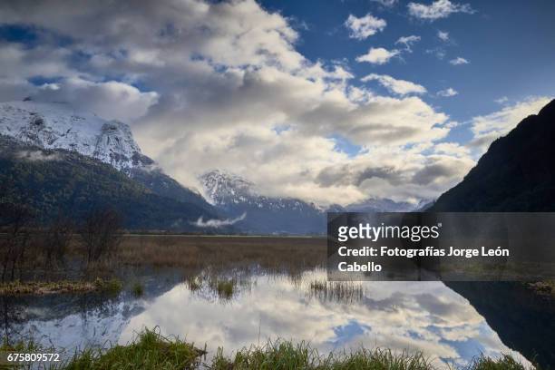 early morning winter sunlight over the patagonian andes and rio negro wetlands in peulla - luz del sol stock pictures, royalty-free photos & images
