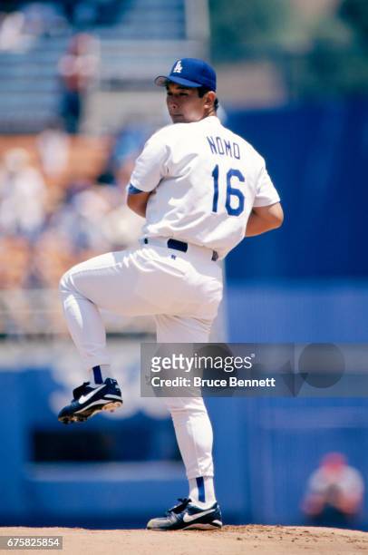 Pitcher Hideo Nomo of the Los Angeles Dodgers pitches during an MLB game against the Cincinnati Reds on July 30, 1995 at Dodger Stadium in Los...