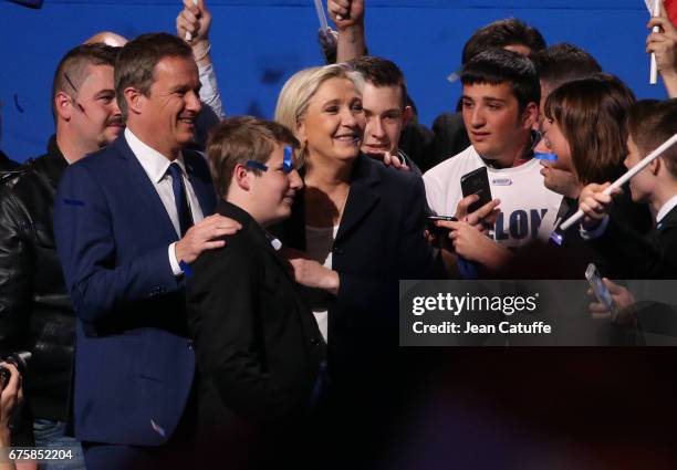 French presidential candidate Marine Le Pen of 'Front National' party is joined on stage by Nicolas Dupont-Aignan, President of 'Debout la France'...