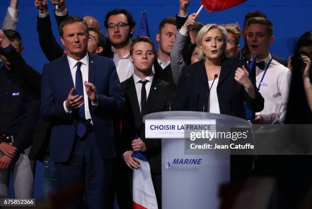 French presidential candidate Marine Le Pen of 'Front National' party is joined on stage by Nicolas Dupont-Aignan, President of 'Debout la France'...