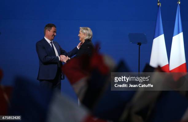 French presidential candidate Marine Le Pen of 'Front National' party is joined on stage by Nicolas Dupont-Aignan, President of 'Debout la France'...