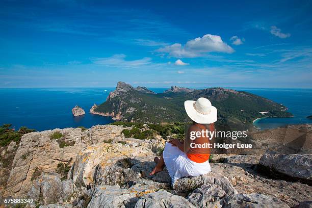 woman with sun hat overlooks cap de formentor - cabo formentor stock pictures, royalty-free photos & images