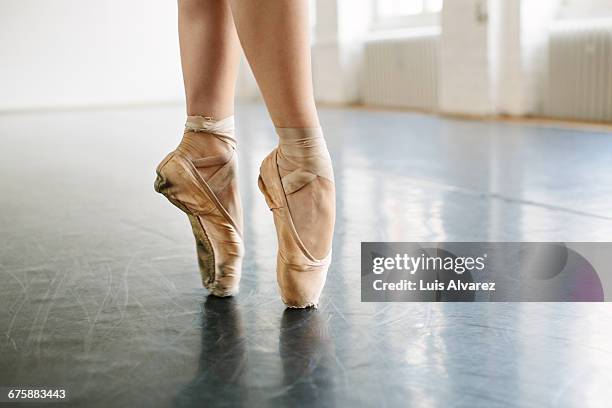 low section of ballerina standing on tip toes at s - ballet dancer stock pictures, royalty-free photos & images
