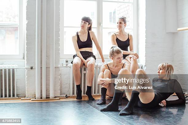 female ballet dancers resting after rehearsals - dance rehearsal stock pictures, royalty-free photos & images