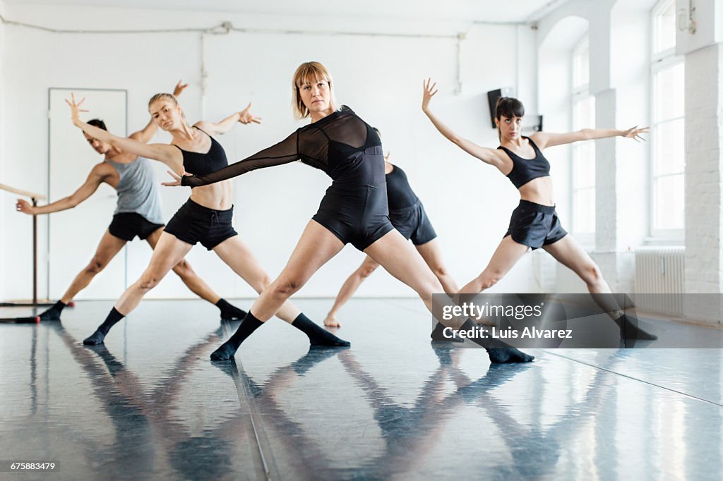 Ballet dancers dancing in rehearsal studio