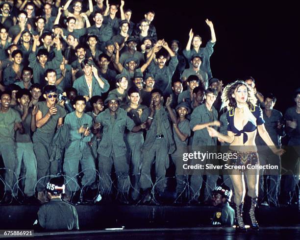 Playboy Playmate performs for the troops in a scene from the film 'Apocalypse Now', directed by Francis Ford Coppola, 1979.