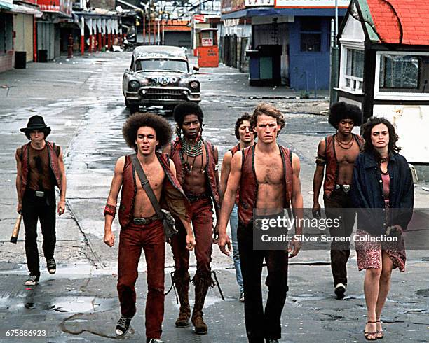 In a scene from the film 'The Warriors' , members of the titular gang walk west along Bowery Street in Coney Island, New York, New York, 1979....