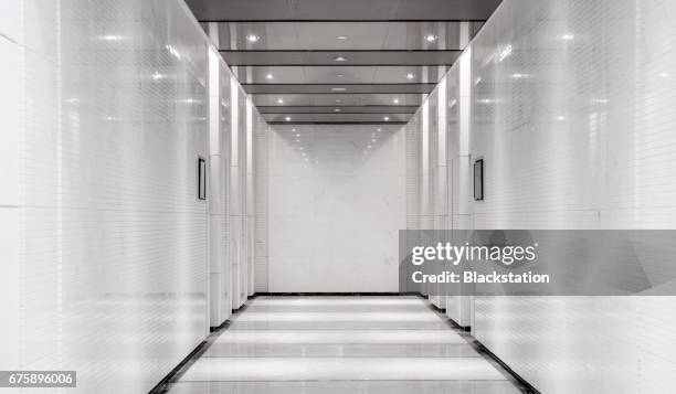 a elevator hall of a office building - office hallway stock pictures, royalty-free photos & images