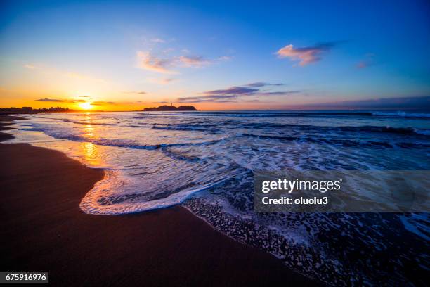 beautiful sunrise on the beach with enoshima - enoshima island stock pictures, royalty-free photos & images