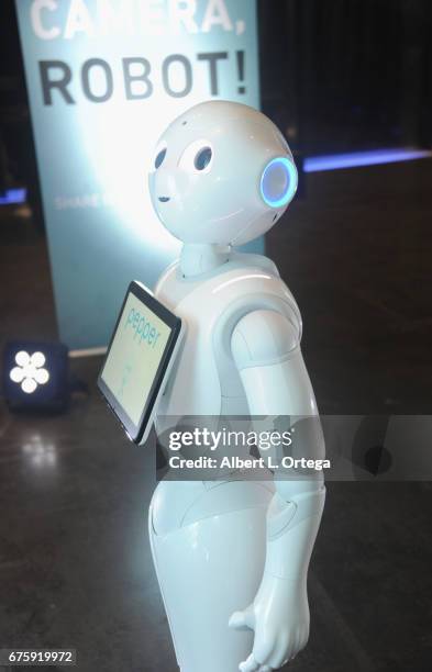 Pepper of Softbank Robotics greet party guests at the Silicon Valley Comic Con: Tech Research Party held at The GlassHouse on April 21, 2017 in San...