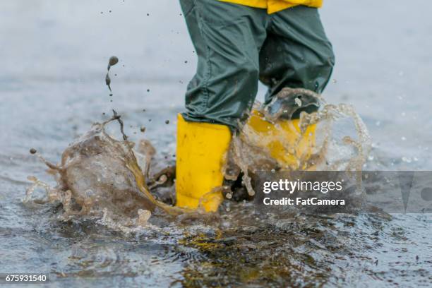 big jump - rubber boots imagens e fotografias de stock