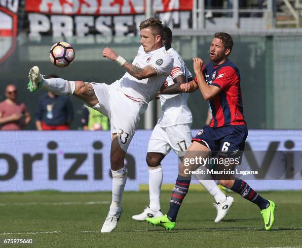 Marcus Rohden of Crotone competes for the ball with Juraj Kucka of Milan during the Serie A match between FC Crotone and AC Milan at Stadio Comunale...