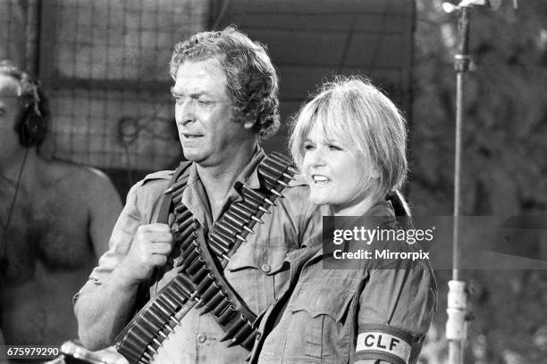 Actor Michael Caine with Valerie Perrine during filming of their latest movie "Water" in North Devon. 6th July 1984.